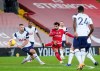 Liverpool's Mohamed Salah, center, attempts a shot on goal during the English Premier League soccer match between Liverpool and Tottenham Hotspur at Anfield in Liverpool, England, Wednesday, Dec. 16, 2020. (AP Photo/Jon Super)