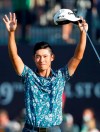 United States' Collin Morikawa celebrates on the 18th green after winning the British Open Golf Championship at Royal St George's golf course Sandwich, England, Sunday, July 18, 2021. (AP Photo/Peter Morrison)