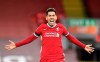 Liverpool's Roberto Firmino celebrates after scoruing his sides 2nd goal during their English Premier League soccer match between Liverpool and Tottenham Hotspur at Anfield in Liverpool, England, Wednesday, Dec., 16, 2020. (Peter Powell/ Pool via AP)