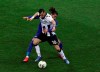 FILE - In this March 8, 2020 file photo, Fiorentina's Martin Caceres and Udinese's Ilija Nestrovski, foreground, vie for the ball during the Italian Serie A soccer match between Udinese and Fiorentina, at the Dacia Arena stadium in Udine, Italy. Udinese president Giampaolo Pozzo recalled that the team was quarantined, after learning that Fiorentina -- the team it faced on March 8 a day before the league was suspended -- had three players who tested positive for COVID-19. (Andrea Bressanutti/LaPresse via AP)