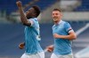 Lazio's Felipe Caicedo, left, celebrates after scoring his side's 3rd goal during a Serie A soccer match between Lazio and Crotone at Rome's Olympic stadium, Friday, March 12, 2021. (Alfredo Falcone/LaPresse via AP)