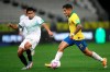 Brazil's Philippe Coutinho, right, runs with the ball as Bolivia's Diego Wayar challenges him during a qualifying soccer match for the FIFA World Cup Qatar 2022 at the Neo Quimica arena in Sao Paulo, Brazil, Friday, Oct. 9, 2020. (Buda Mendes/Pool via AP)