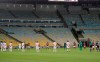 Players of Bangu, wearing white uniforms, and Flamengo pay a minute of silence for the victims of the coronavirus prior to a Rio de Janeiro soccer league match at the Maracana stadium in Rio de Janeiro, Brazi, Thursday, June 18, 2020. Rio de Janeiro's soccer league resumed after a three-month hiatus because of the coronavirus pandemic. The match is being played without spectators to curb the spread of COVID-19. (AP Photo/Leo Correa)