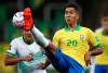 Brazil's Roberto Firmino, right, fights for the ball with Bolivia's Gabriel Valverde during a qualifying soccer match for the FIFA World Cup Qatar 2022 at the Neo Quimica arena in Sao Paulo, Brazil, Friday, Oct. 9, 2020. (Buda Mendes/Pool via AP)