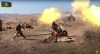 In this image taken from video released by Azerbaijan's Defense Ministry on Tuesday, Oct. 20, 2020, Azerbaijan army soldiers fire an artillery piece during fighting with forces of the self-proclaimed Republic of Nagorno-Karabakh. Azerbaijan Defense Ministry claims that Armenian forces tried to carry out an offensive that was met by an artillery strike from Azerbaijan, causing a large number of casualties among Armenian forces. (Azerbaijan's Defense Ministry via AP)
