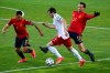 Spain's Pedro Porro, left, Georgia's Khvicha Kvaratskhelia, center and Spain's Fabian Ruiz challenge for the ball during the World Cup 2022 group B qualifying soccer match between Georgia and Spain at Boris Paichadze Dinamo Arena in Tbilisi, Georgia, Sunday, March 28, 2021. (AP Photo/Zurab Tsertsvadze)