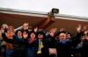 In this photo taken on Thursday, March 19, 2020, soccer fans of FC Bate cheer during the Belarus Championship soccer match between Energetik-BGU and Bate in Minsk, Belarus. Almost all of Europe has suspended soccer games amid the coronavirus pandemic, but Belarus is just getting started as officials insist they're not starting the season just to suspend it later. Unlike most of Europe, it runs on a calendar-year format, playing from March through December to avoid the snow-bound winter. For some people the new COVID-19 coronavirus causes only mild or moderate symptoms, but for some it can cause severe illness. (AP Photo/Sergei Grits)
