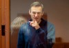 FILE - In this Feb. 16, 2021, file photo taken from footage provided by the Babuskinsky District Court, Russian opposition leader Alexei Navalny gestures during a court hearing in Moscow, Russia. Several doctors were prevented Tuesday, April 20, from seeing Navalny in a prison hospital after his three-week hunger strike, and prosecutors also detailed a sweeping, new case against his organization. (Babuskinsky District Court Press Service via AP, File)