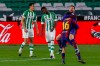 Barcelona's Lionel Messi is congratulated by Barcelona's Pedri after scoring his first goal during La Liga soccer match between Betis and FC Barcelona at the Benito Villamarin stadium in Seville, Spain, Sunday, Feb. 7, 2021. (AP Photo/Miguel Morenatti)