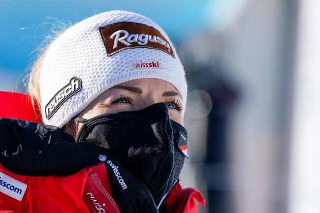 Switzerland's Lara Gut-Behrami watches an alpine ski, women's World Cup super-G in St. Anton, Austria, Sunday, Jan.10, 2021. (AP Photo/Giovanni Auletta)