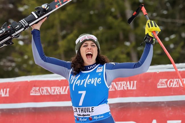 Italy's Federica Brignone celebrates taking second place in an alpine ski, women's World Cup Super G, in La Thuile, Italy, Saturday, Feb. 29, 2020. (AP Photo/Alessandro Trovati)