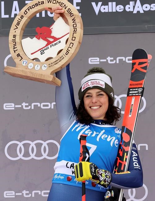 Italy's Federica Brignone celebrates taking second place in an alpine ski, women's World Cup Super G, in La Thuile, Italy, Saturday, Feb. 29, 2020. (AP Photo/Alessandro Trovati)