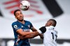 Arsenal's Pierre-Emerick Aubameyang, left, and Fulham's Ivan Cavaleiro vie for the ball during the English Premier League soccer match between Fulham and Arsenal in London, Saturday, Sept. 12, 2020. (Ben Stansall/Pool via AP)