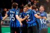 Atalanta players celebrate after Atalanta's Hans Hateboer scored his side's opening goal during the Champions League round of 16, first leg, soccer match between Atalanta and Valencia at the San Siro stadium in Milan, Italy, Wednesday, Feb. 19, 2020. (AP Photo/Antonio Calanni)