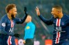 PSG's Neymar, left, celebrates with PSG's Kylian Mbappe after scoring his side's opening goal during the French League One soccer match between PSG and Nantes at the Parc des Princes stadium in Paris, Wednesday, Dec. 4, 2019. The goal was disallowed on a VAR (video assistant referee) decision.(AP Photo/Michel Euler)