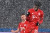 Bayern's Kingsley Coman, center, celebrates after scoring his side's opening goal during the German Bundesliga soccer match between Hertha BSC Berlin and FC Bayern Munich in Berlin, Germany, Friday, Feb. 5, 2021. (John MacDougall/pool via AP)