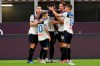 Atalanta's Duvan Zapata, center, celebrates after scoring his side's opening goal during the Serie A soccer match between AC Milan and Atalanta at the San Siro stadium, in Milan, Italy, Friday, July 24, 2020. (AP Photo/Antonio Calanni)
