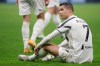 Juventus' Cristiano Ronaldo sits on the ground during a Serie A soccer match between Inter Milan and Juventus at the San Siro stadium in Milan, Italy, Sunday, Jan. 17, 2021. (AP Photo/Luca Bruno)