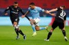 Manchester City's Gabriel Jesus, center, is challenged by Moenchengladbach's Alassane Plea, left and Moenchengladbach's Florian Neuhaus during the Champions League round of 16 first leg soccer match between Borussia Monchengladbach and Manchester City at the Puskas Arena stadium in Budapest, Hungary, Wednesday, Feb. 24, 2021. (AP Photo/Laszlo Balogh)