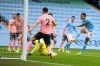 Manchester City's Gabriel Jesus, right, scores his side's opening goal during the English Premier League match between Manchester City and Sheffield United at the the City of Manchester Stadium in Manchester, England, Saturday, Jan. 30, 2021. (Michael Regan/Pool via AP)