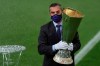 An UEFA official carries the trophy ahead of the Europa League final soccer match between Sevilla and Inter Milan in Cologne, Germany, Friday, Aug. 21, 2020. (Friedemann Vogel/Pool via AP)