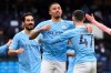 Manchester City's Gabriel Jesus, center, celebrates after scoring his side's opening goal during the English Premier League match between Manchester City and Sheffield United at the the City of Manchester Stadium in Manchester, England, Saturday, Jan. 30, 2021. (Michael Regan/Pool via AP)