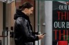 AC Milan's Zlatan Ibrahimovic uses his mobile phone during a Serie A soccer match between AC Milan and Napoli, at the San Siro stadium in Milan, Italy, Sunday, March 14, 2021. (AP Photo/Luca Bruno)