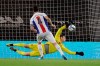 Bournemouth's goalkeeper Asmir Begovic saves Crystal Palace's Luka Milivojevic during the English League Cup soccer match between Bournemouth and Crystal Palace at the Dean Court stadium in Bournemouth, England, Tuesday, Sept. 15, 2020. (AP Photo/Kirsty Wigglesworth, Pool)