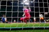 Atalanta's Hans Hateboer, right, scores his side's opening goal during the Champions League round of 16, first leg, soccer match between Atalanta and Valencia at the San Siro stadium in Milan, Italy, Wednesday, Feb. 19, 2020. (AP Photo/Antonio Calanni)