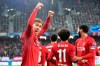 Liverpool's Roberto Firmino, left, celebrates after Liverpool's Mohamed Salah scored his side's second goal during the group E Champions League soccer match between Salzburg and Liverpool, in Salzburg, Austria, Tuesday, Dec. 10, 2019. (AP Photo/Kerstin Joensson)