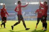 Manchester United's Bruno Fernandes, right, celebrates after scoring his side's second goal during the English Premier League soccer match between Everton and Manchester United at the Goodison Park stadium in Liverpool, England, Saturday, Nov. 7, 2020. (Carl Recine/Pool via AP)