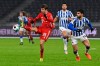 Bayern's Thomas Mueller is challenged by Berlin's Omar Alderete, right, during the German Bundesliga soccer match between Hertha BSC Berlin and FC Bayern Munich in Berlin, Germany, Friday, Feb. 5, 2021. (John MacDougall/pool via AP)