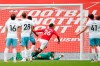 Manchester United's Mason Greenwood scores his side's opening goal during the English Premier League soccer match between Manchester United and West Ham at the Old Trafford stadium in Manchester, England, Wednesday, July 22, 2020. (Clive Brunskill/Pool via AP)