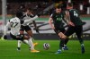 Fulham's Josh Maja scores a goal that was later disallowed for handball during the English Premier League soccer match between Fulham v Tottenham Hotspur at the Craven Cottage stadium in London, Thursday, March 4, 2021. (Neil Hall/Pool via AP)