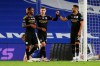 Manchester City's Raheem Sterling, left, celebrates after scoring his side's fifth goal during the English Premier League soccer match between Brighton and Manchester City at the Falmer stadium in Brighton, England, Saturday, July 11, 2020. (Cath Ivill/Pool via AP)