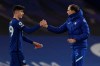 Chelsea's head coach Thomas Tuchel greets Chelsea's Mason Mount at the end of the English Premier League soccer match between Chelsea and Everton at the Stamford Bridge stadium in London, Monday, March 8, 2021. (Glyn Kirk/Pool via AP)