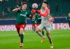 Lokomotiv's Vitali Lystsov, left, and Salzburg's Dominik Szoboszlai challenge for the ball during the Champions League, group A, soccer match between Lokomotiv Moscow and RB Salzburg at the Lokomotiv stadium in Moscow, Russia, Tuesday, Dec. 1, 2020. (Maxim Shipenkov/Pool via AP)