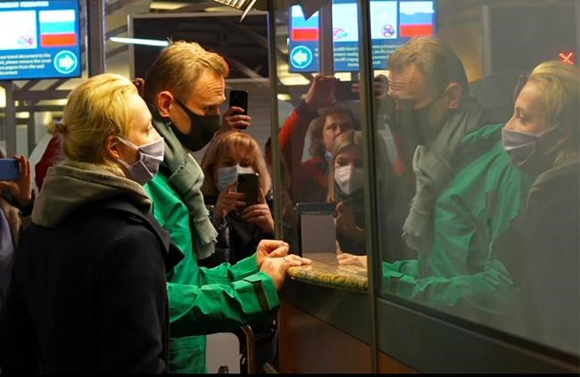 In this grab taken from video, Alexei Navalny and his wife Yulia stand at the passport control before Navalny was detained by police after arriving at Sheremetyevo airport, outside Moscow, Russia, Sunday, Jan. 17, 2021. Russia's prison service says opposition leader Alexei Navalny has been detained at a Moscow airport after returning from Germany. (AP)