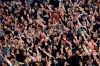 In this Wednesday, June 10, 2020. photo, Red Star fans support their team during a Serbian National Cup semi final soccer match between Partizan and Red Star in Belgrade, Serbia. Red Star Belgrade soccer club director Zvezdan Terzic says he has tested positive for the coronavirus, days after the Serbian champions played matches in front of thousands of fans despite the pandemic. (AP Photo/Darko Vojinovic)