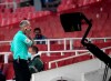 Referee Martin Atkinson checks the VAR screen after Aston Villa's John McGinn scoring a disallowed goal during the English Premier League soccer match between Arsenal and Aston Villa at the Emirates stadium in London, Sunday, Nov. 8, 2020. (Andy Rain/Pool via AP)