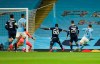 Manchester City's Ferran Torres, right, scores his side's opening goal during the Champions League group C soccer match between Manchester City and Olympiacos at the Etihad stadium in Manchester, England, Tuesday, Nov. 3, 2020. (AP Photo/Dave Thompson)