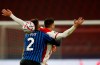 Atalanta's Rafael Toloi, front, duels for the ball with Ajax's Dusan Tadic during the group D Champions League soccer match between Ajax and Atalanta at the Johan Cruyff ArenA in Amsterdam, Netherlands, Wednesday, Dec. 9, 2020. (AP Photo/Peter Dejong)