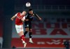 Arsenal's Rob Holding, left, jumps for the ball with Aston Villa's Ollie Watkins during the English Premier League soccer match between Arsenal and Aston Villa at the Emirates stadium in London, Sunday, Nov. 8, 2020. (Richard Heathcote/Pool via AP)