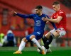 Chelsea's Christian Pulisic, left, duels for the ball with Manchester United's Scott McTominay during the English Premier League soccer match between Manchester United and Chelsea, at the Old Trafford stadium in Manchester, England, Saturday, Oct. 24, 2020. (Phil Noble/Pool via AP)