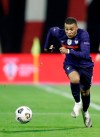 France's Kylian Mbappe runs for the ball during the UEFA Nations League soccer match between Croatia and France at Maksimir Stadium in Zagreb, Croatia, Wednesday, Oct. 14, 2020. (AP Photo/Darko Bandic)