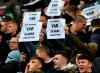 Fans hold banners against Video Assistant Referee (VAR) during the English Premier League soccer match between Manchester City and Crystal Palace at Etihad stadium in Manchester, England, Saturday, Jan. 18, 2020. (AP Photo/Rui Vieira)