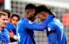 Leicester's Demarai Gray, right, celebrates with Leicester's Kelechi Iheanacho after scoring his side's second goal during the English Premier League soccer match between West Ham Utd and Leicester City at the London Stadium in London, Saturday, Dec. 28, 2019. (AP Photo/Petros Karadjias)