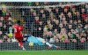 Norwich City's goalkeeper Tim Krul, right, makes a save in front of Liverpool's Naby Keita during the English Premier League soccer match between Norwich City and Liverpool at Carrow Road Stadium in Norwich, England, Saturday, Feb. 15, 2020. (AP Photo/Frank Augstein)