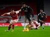 Manchester United's Marcus Rashford, right, duels for the ball with Arsenal's Granit Xhaka during the English Premier League soccer match between Arsenal and Manchester United at the Emirates stadium in London, Saturday, Jan. 30, 2021. (Andy Rain/Pool via AP)