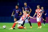 Croatia's Domagoj Vida, front, duels for the ball with France's Anthony Martial, left, during the UEFA Nations League soccer match between Croatia and France at Maksimir Stadium in Zagreb, Croatia, Wednesday, Oct. 14, 2020. (AP Photo/Darko Bandic)